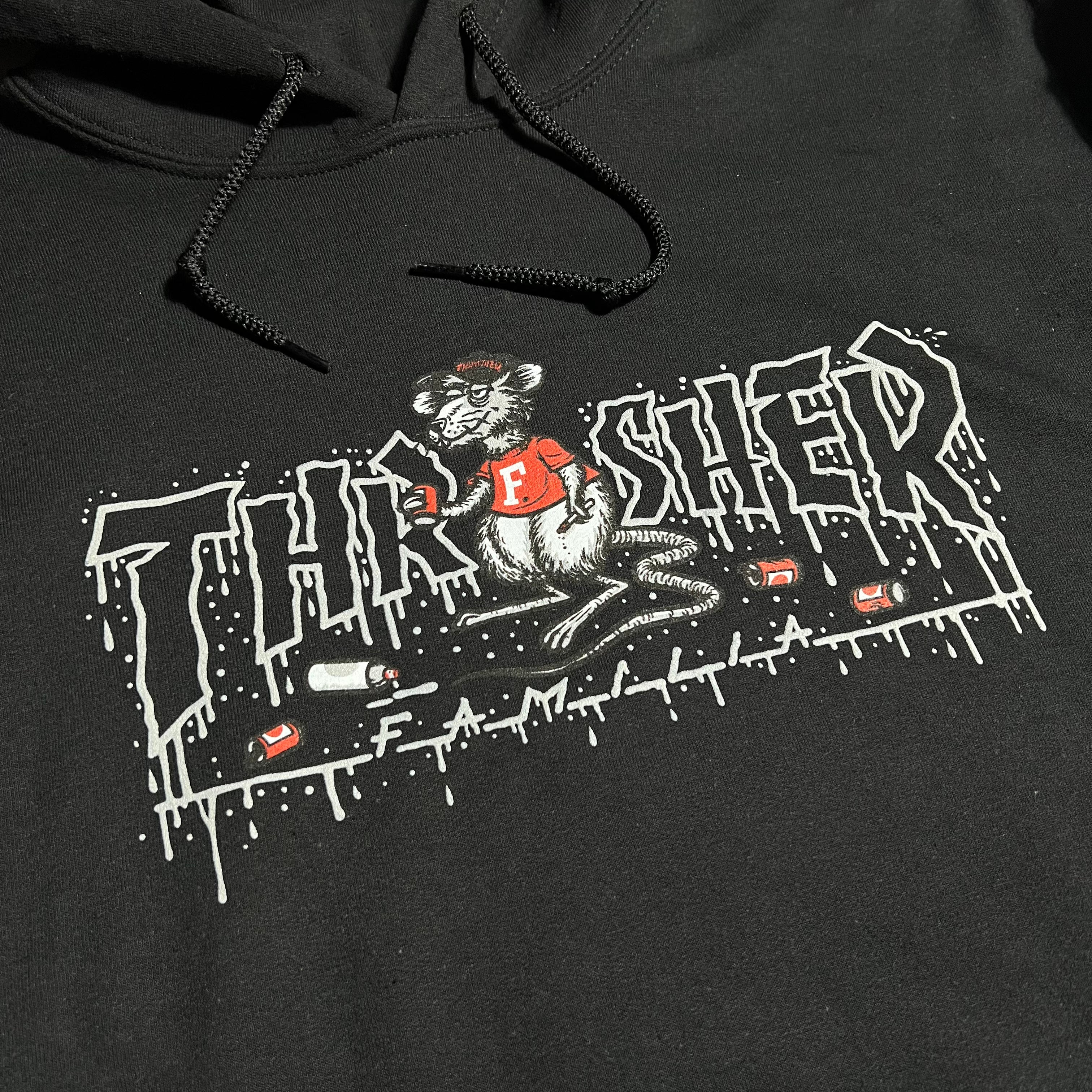 Close detail of Thrasher skate rat art on chest.