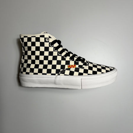 Side view of vans authentic high in checkered canvas with red and yellow tag and white sole.