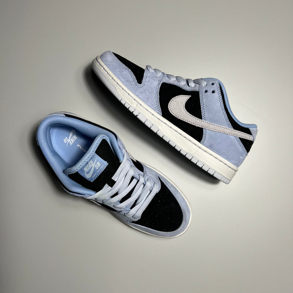 Top and side view of nike sb dunk in aluminum and black suede and off white sole.