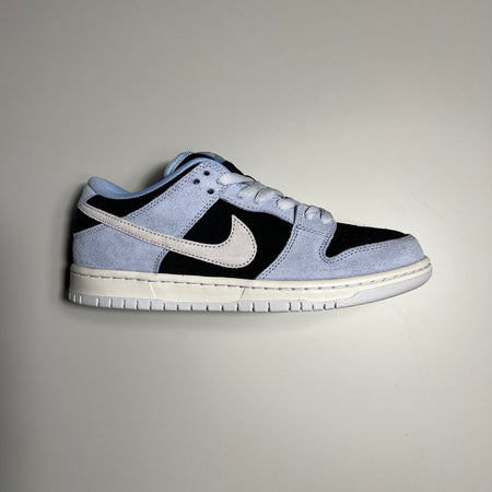 Side view of nike dunk in aluminum grey and black suede with off white sole.