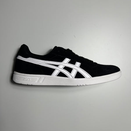 Side view of the gel vickka shoe from asics in black suede and white leather logo and white sole.