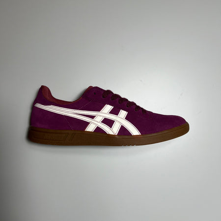 Side view of right shoe. Violet suede with white asics branding and gum outsole