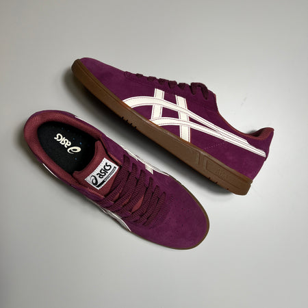 Toe down with side profile. Asics branding on tongue.