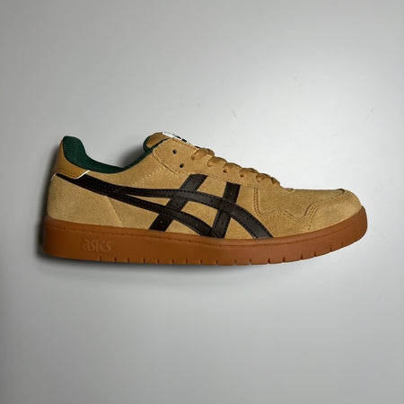 Side view of right shoe. Wood color suede with black asics logo and gum outsole