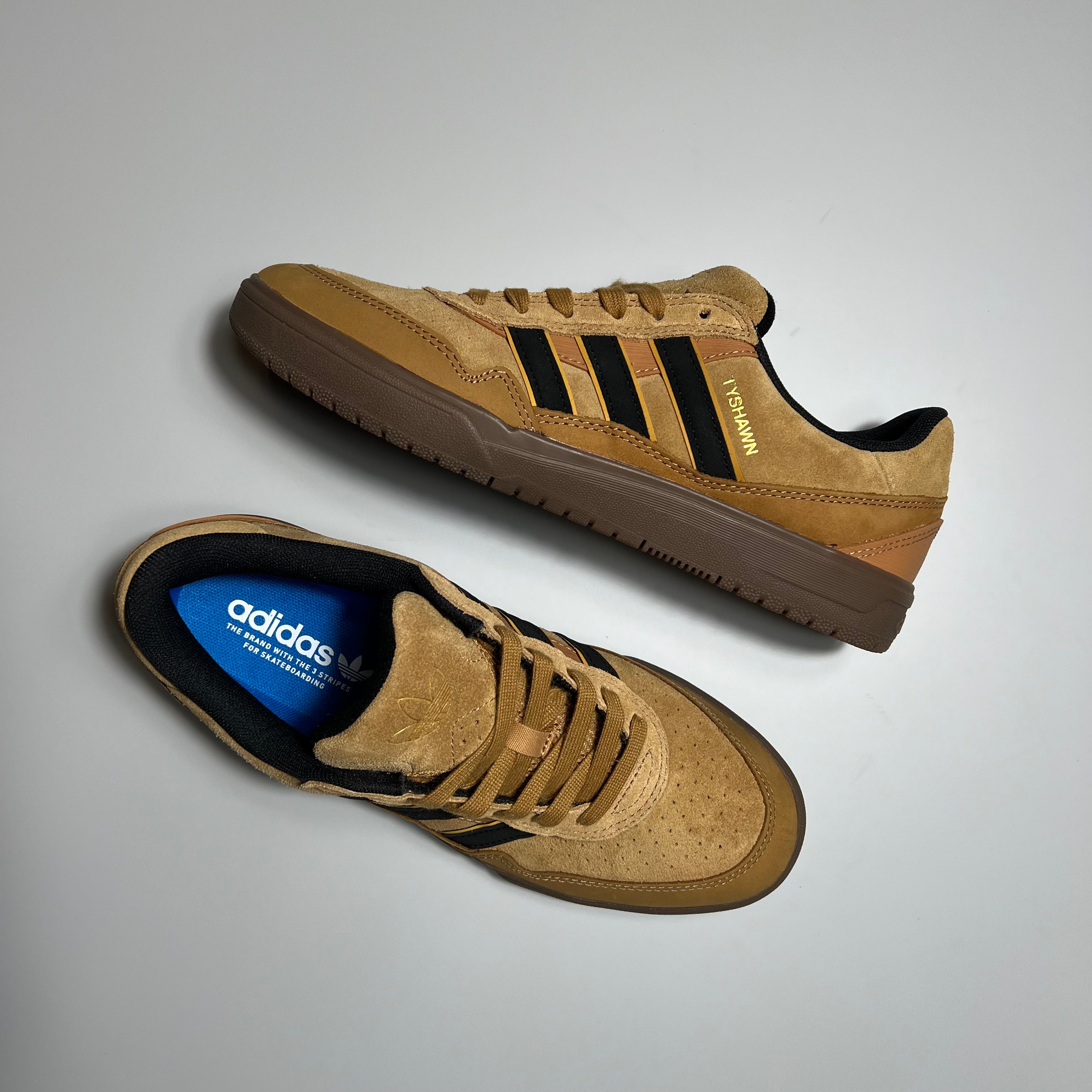 Tyshawn II pro model shoes in brown with black and gold stripes and brown gum sole.