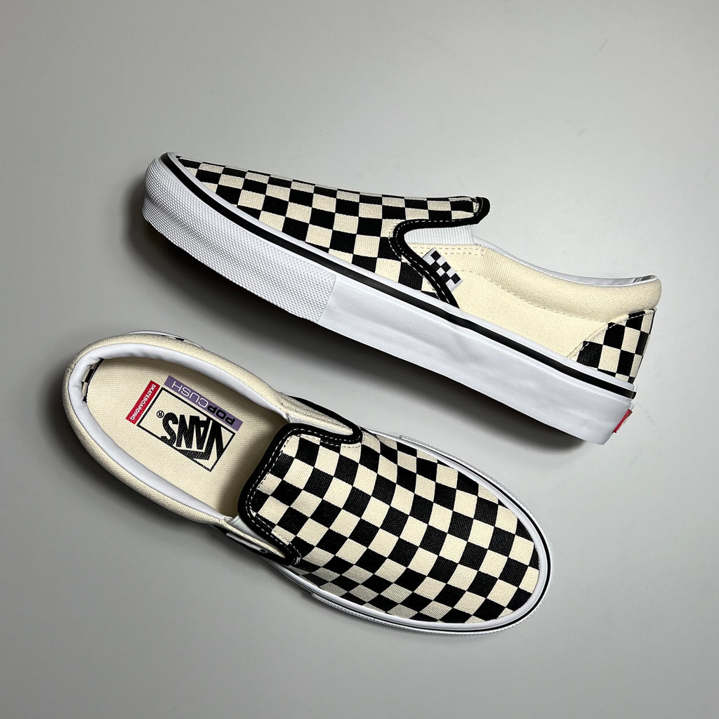 Vans skate slip on in black and white checker and white sole.