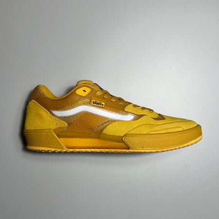 Side image of right shoe. Yellow suede with white side stripe.