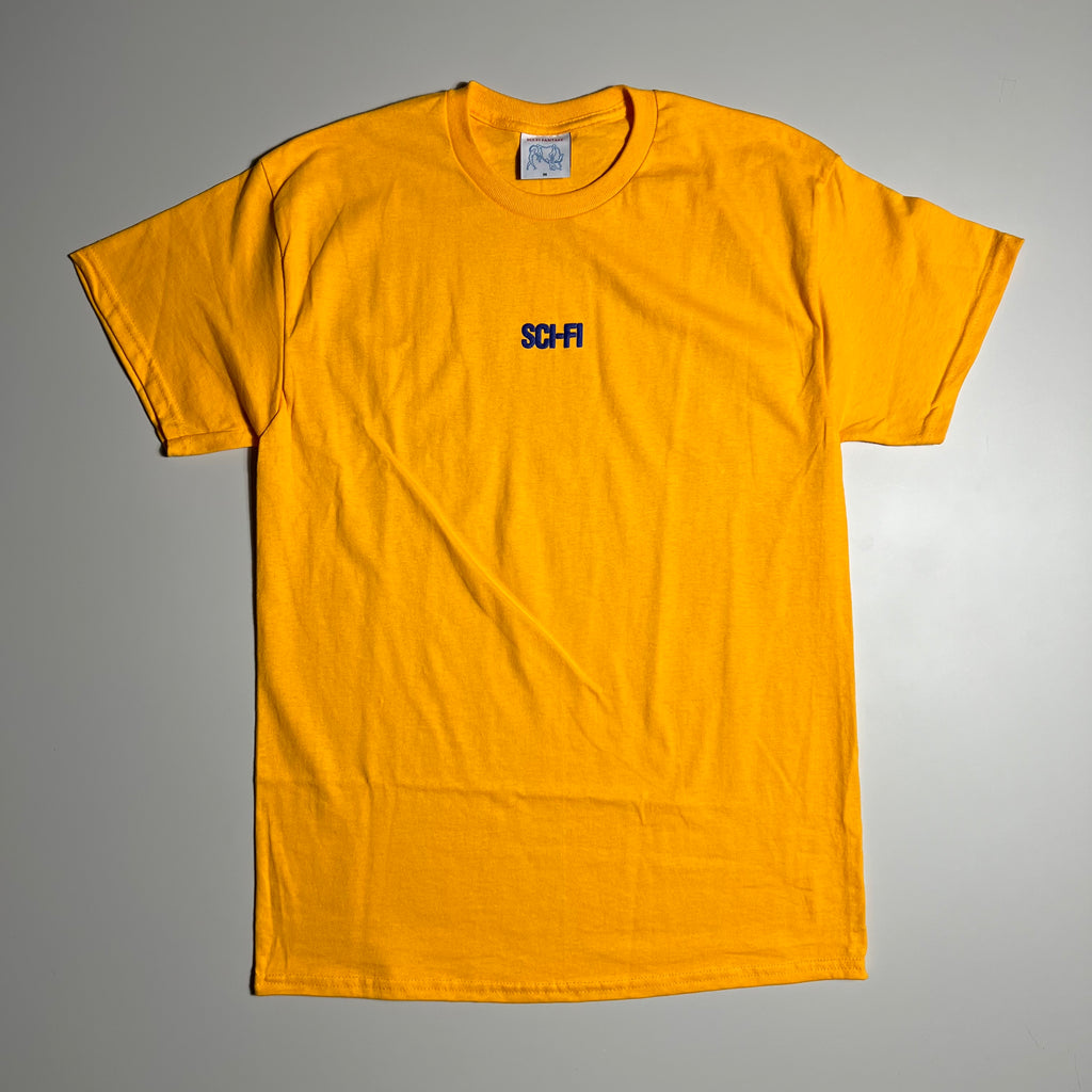 GOLD TEE WITH SCI FI PUFF LOGO CENTER CHEST