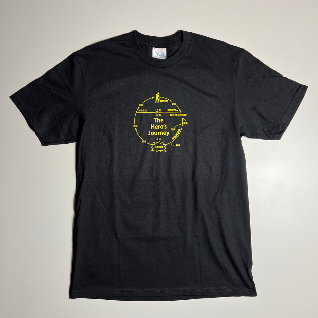 BLACK TEE WITH HERO'S JOURNEY GRAPHIC PRINTED IN YELLOW CENTER CHEST