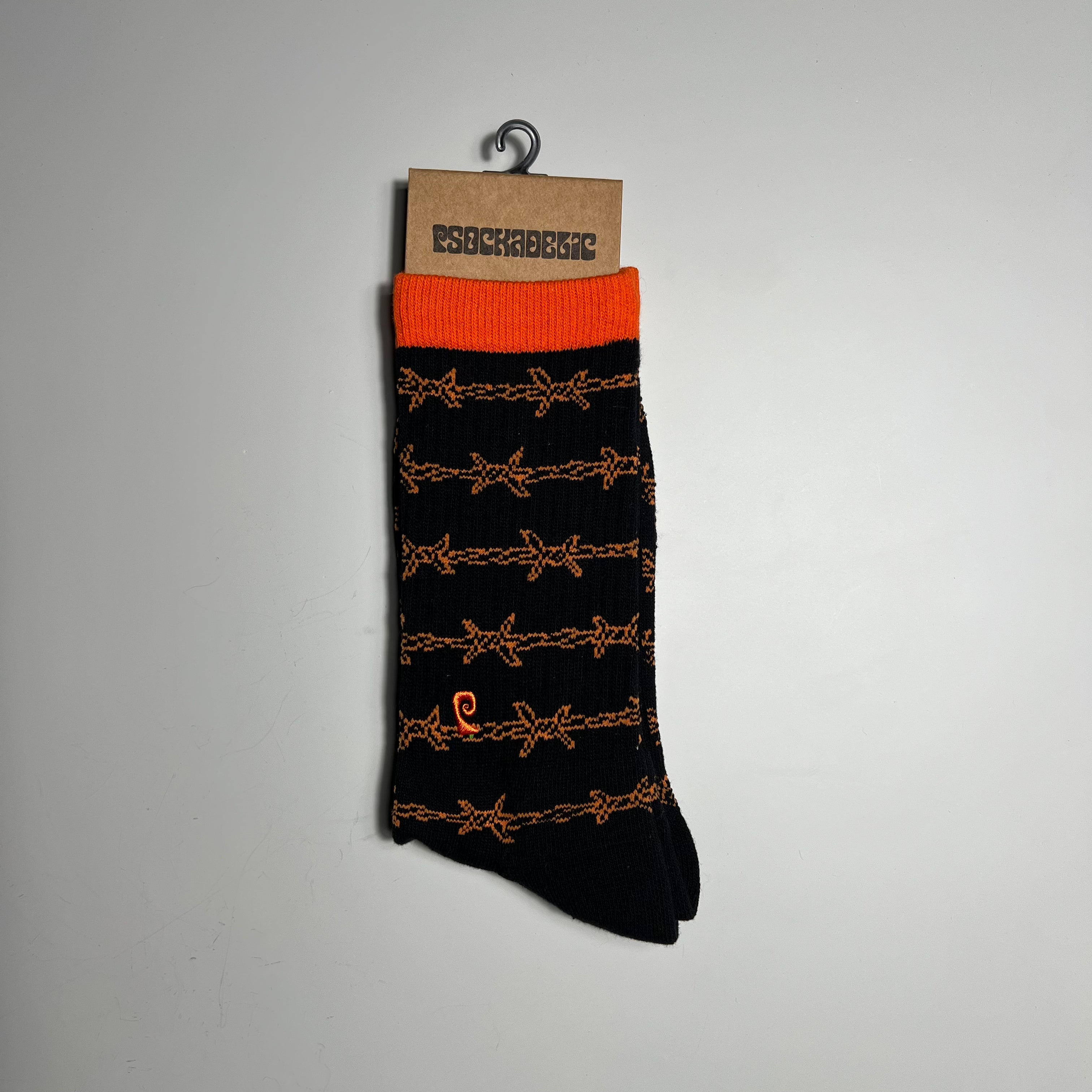 BLACK AND ORANGE SOCK WITH BARBWIRE GRAPHIC