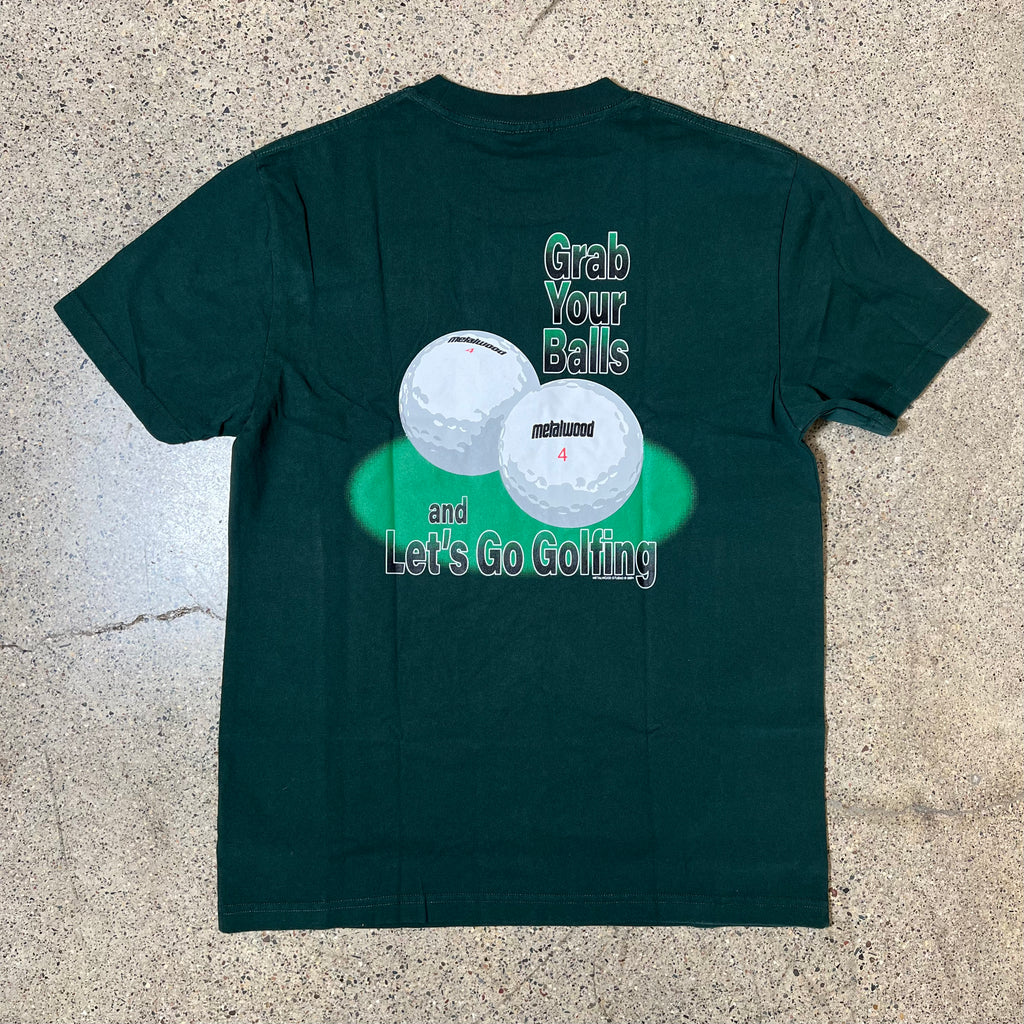 BACK SIDE SPRUCE COLOR TEE WITH METALWOOD GOLF BALLS AND 