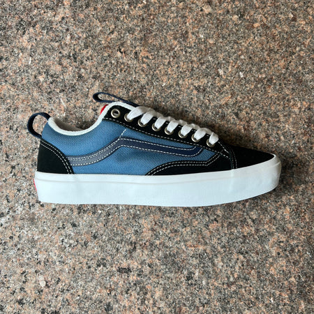 Side profile of right shoe.
Black suede with navy nylon mid panel and blue vans stripe