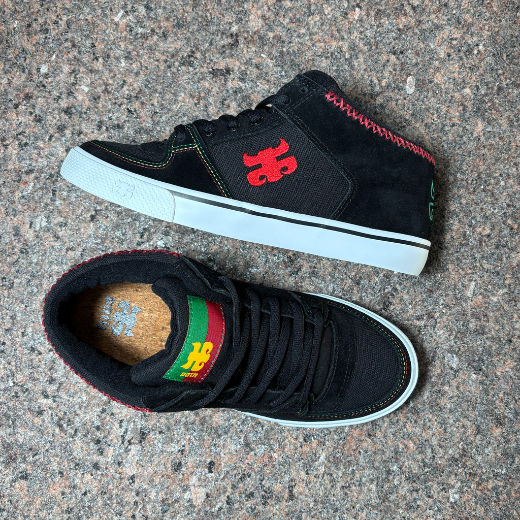 Toe down view with side profile.
Hemp canvas toe box and suede toe. Cork insoles with rasta ipath branding on tongue.