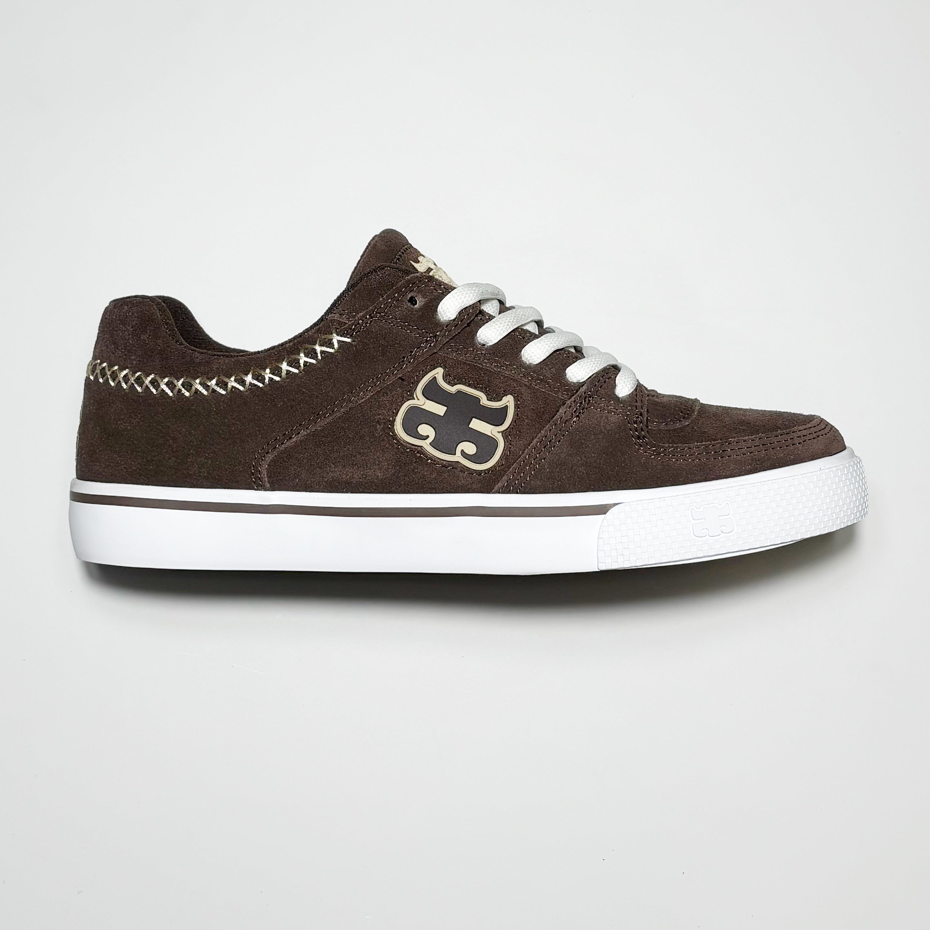 Side image of right shoe.
Brown suede with tan rubber logo on mid-panel.