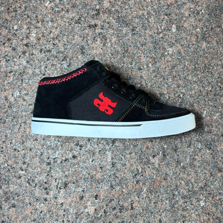 Side view of right shoe. Black suede toe and heel panel with rasta color thread and canvas mid panel. Red ipath logo on mid panel.