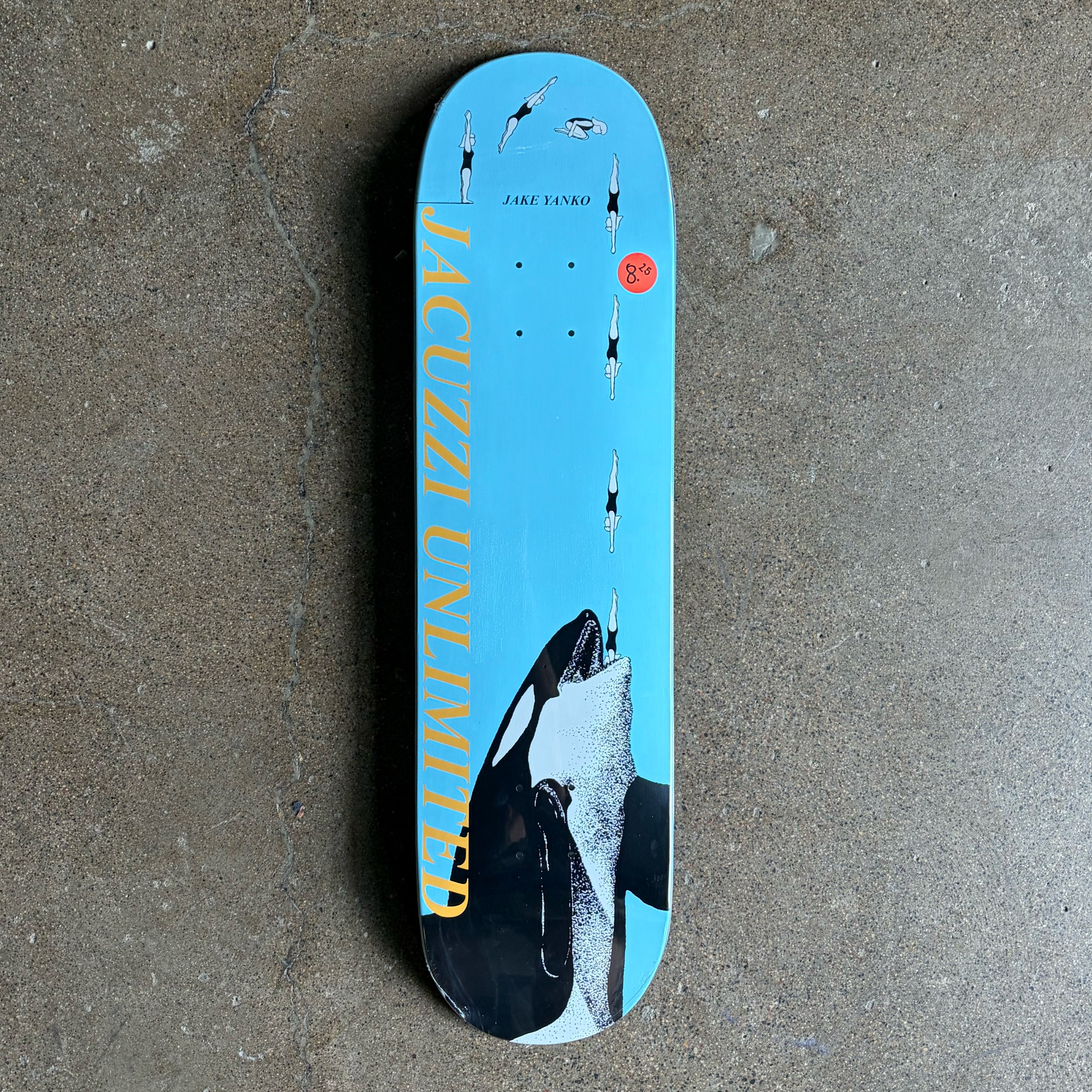 Full image of Jacuzzi skateboard deck.
Cartoon art style diver into a killer whale mouth on blue blackground.