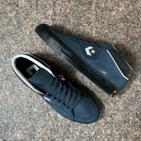 CONVERSE CONS LOUIE LOPEZ PRO MODEL SHOES IN DARK BLUE AND BLACK SOLE DISPLAYED ON GRANITE