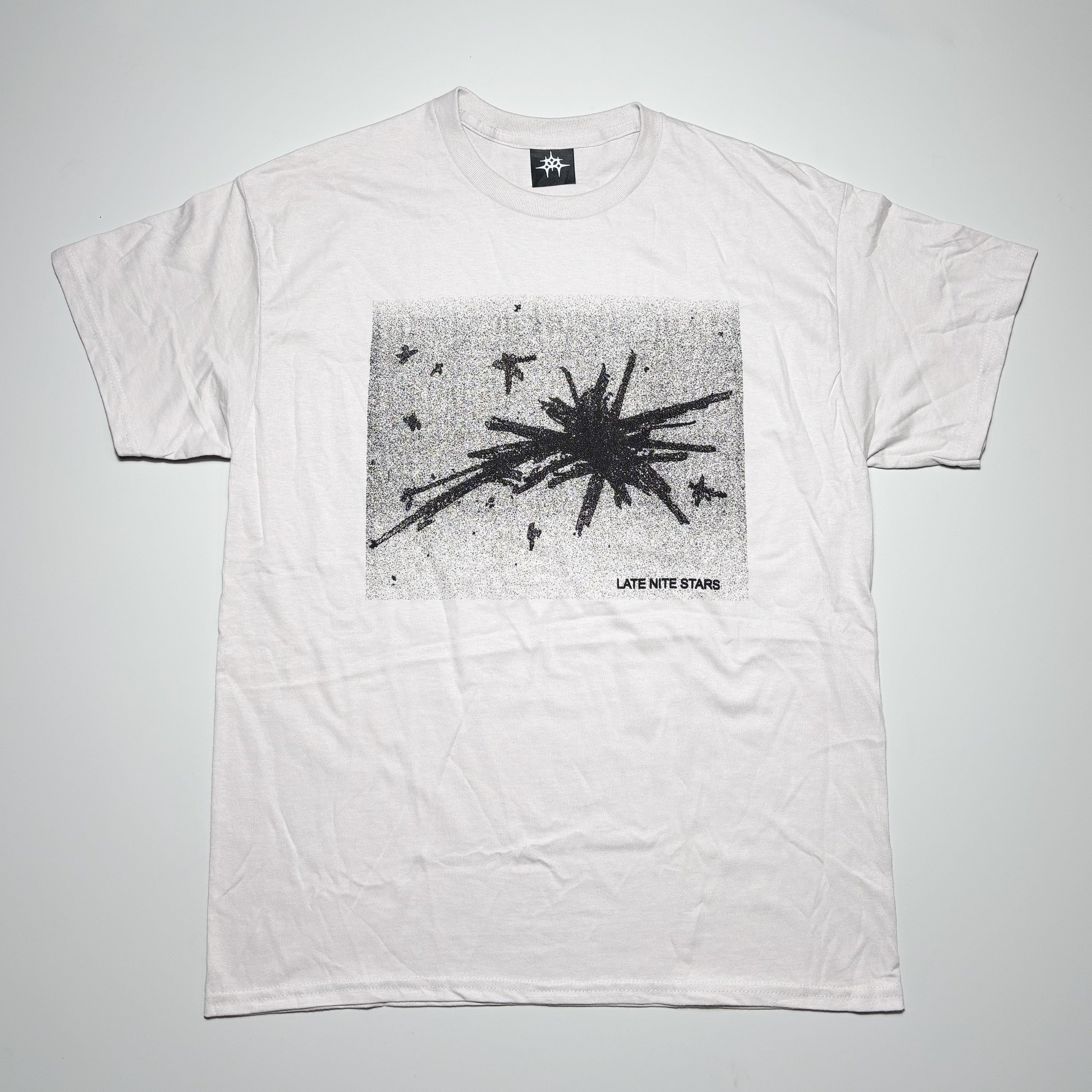 Full front image of off-white tee.
Art printed on chest.