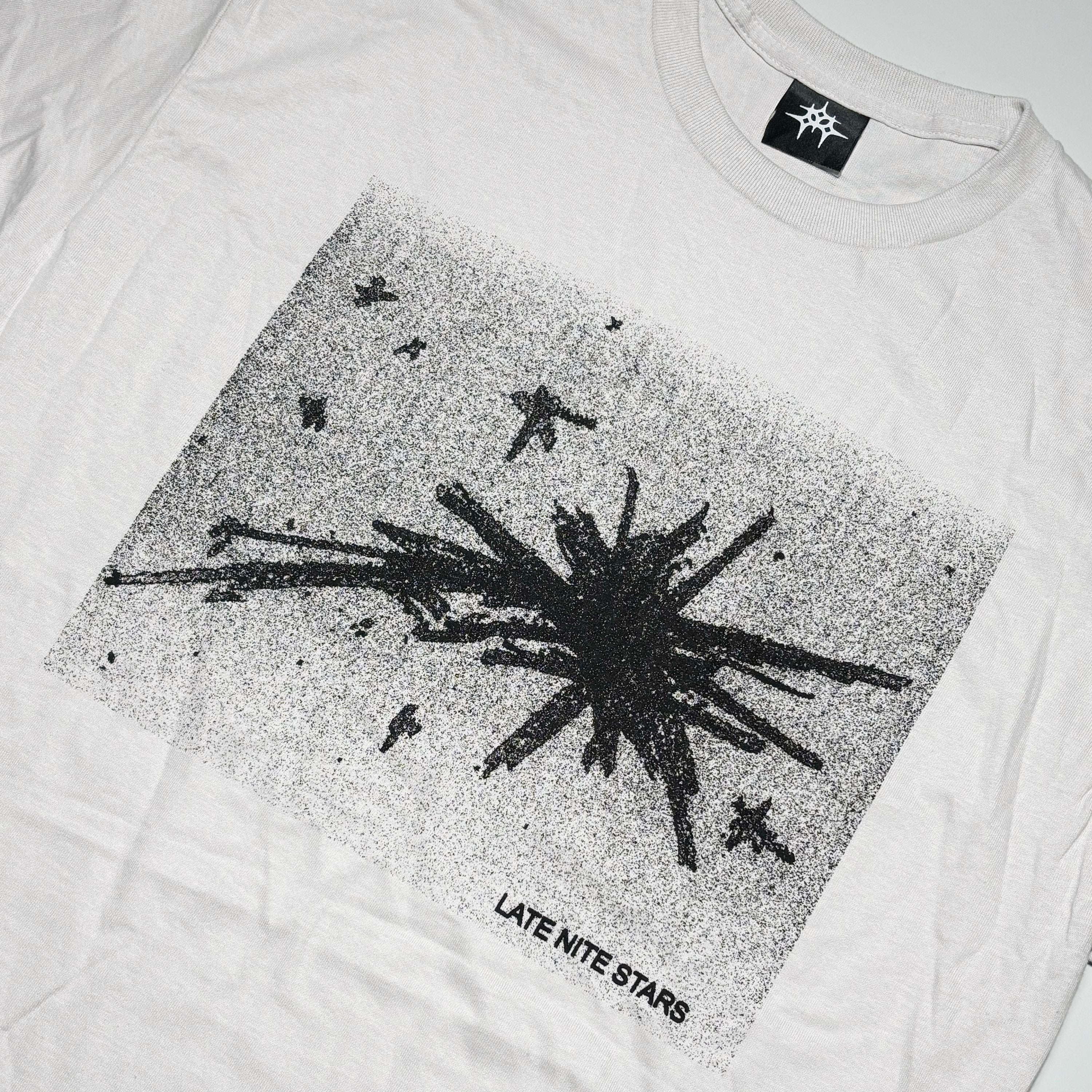 Close detail of starburst art on front.