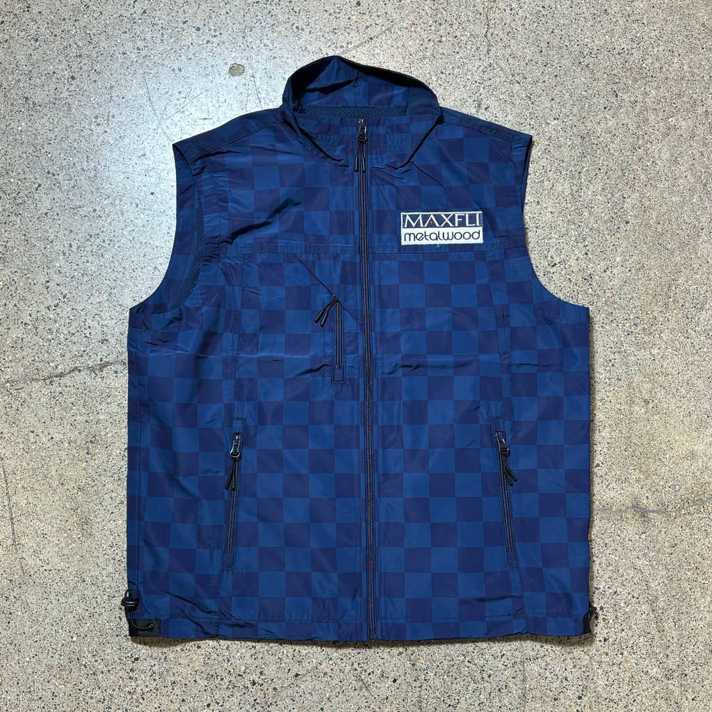 Full image of navy checker tech vest with Maxfli Metalwood patch on chest.