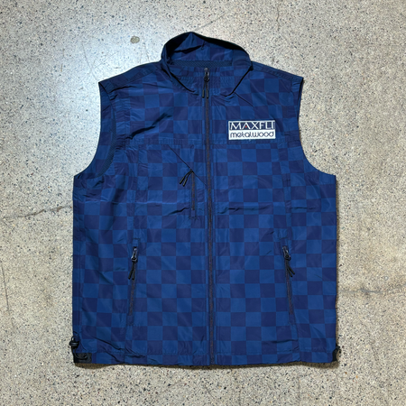 Full image of navy checker tech vest with Maxfli Metalwood patch on chest.