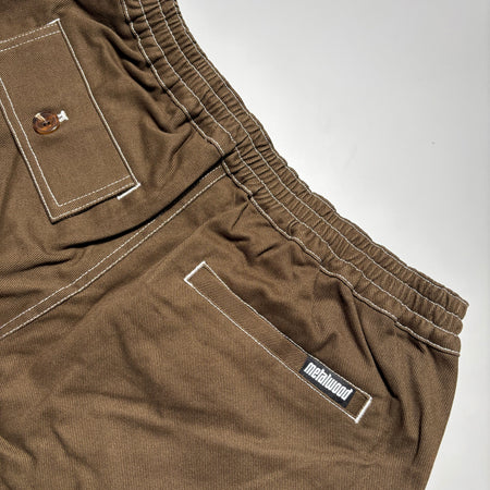 Back detail of elastic waist and pocket detail with woven label on pocket