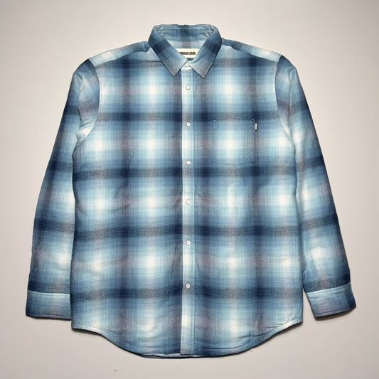 Full image of blue/black plaid woven with snap button closures and poly lined interior.