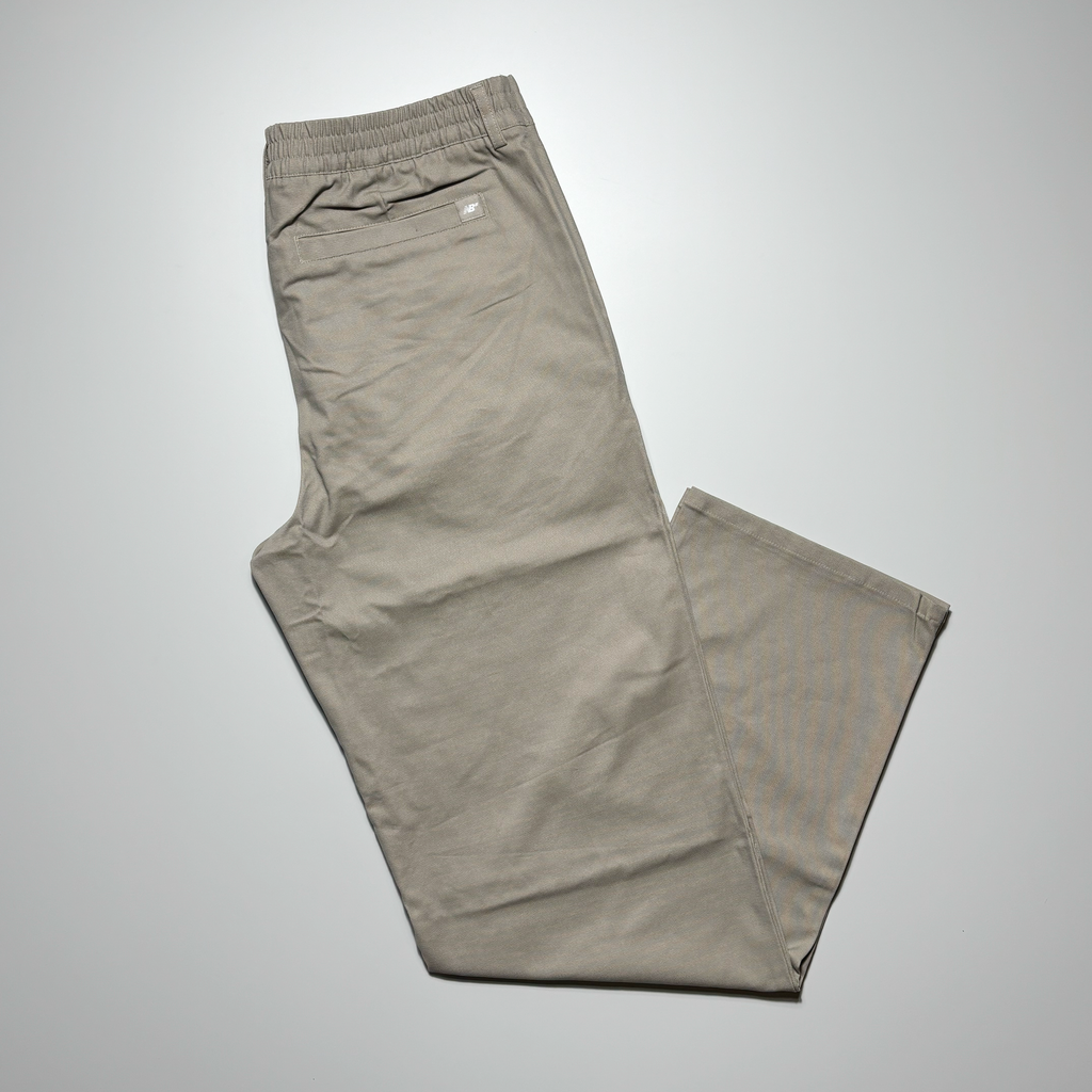 Back image of folded pant. Stone khaki color with NB woven label on back pocket. 