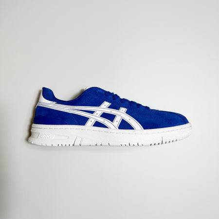 Side view of right shoe. Blue suede with white outsole and asics branding