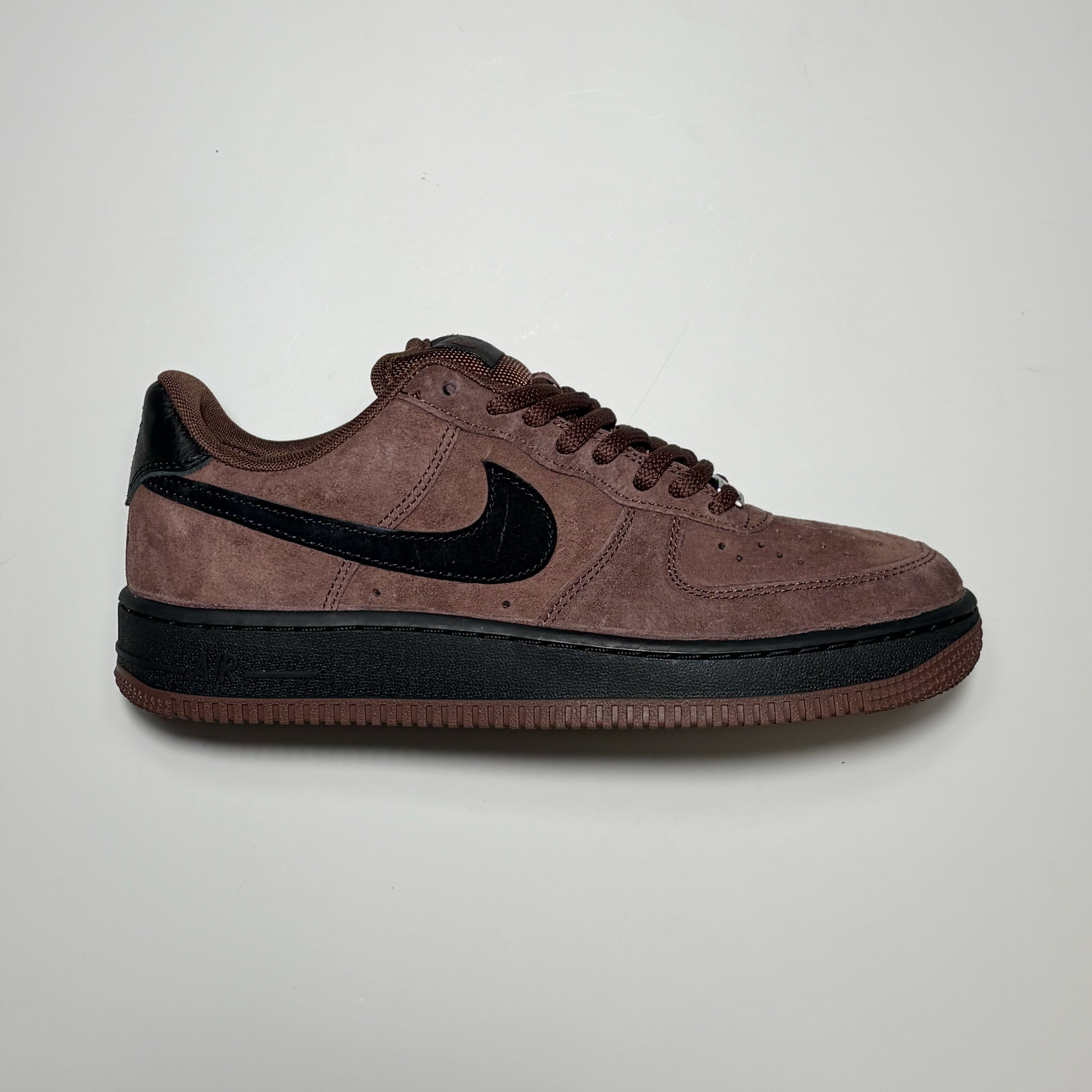 Right side image of Nike SB Air Force 1 in chocolate suede with black swoosh and midsole.