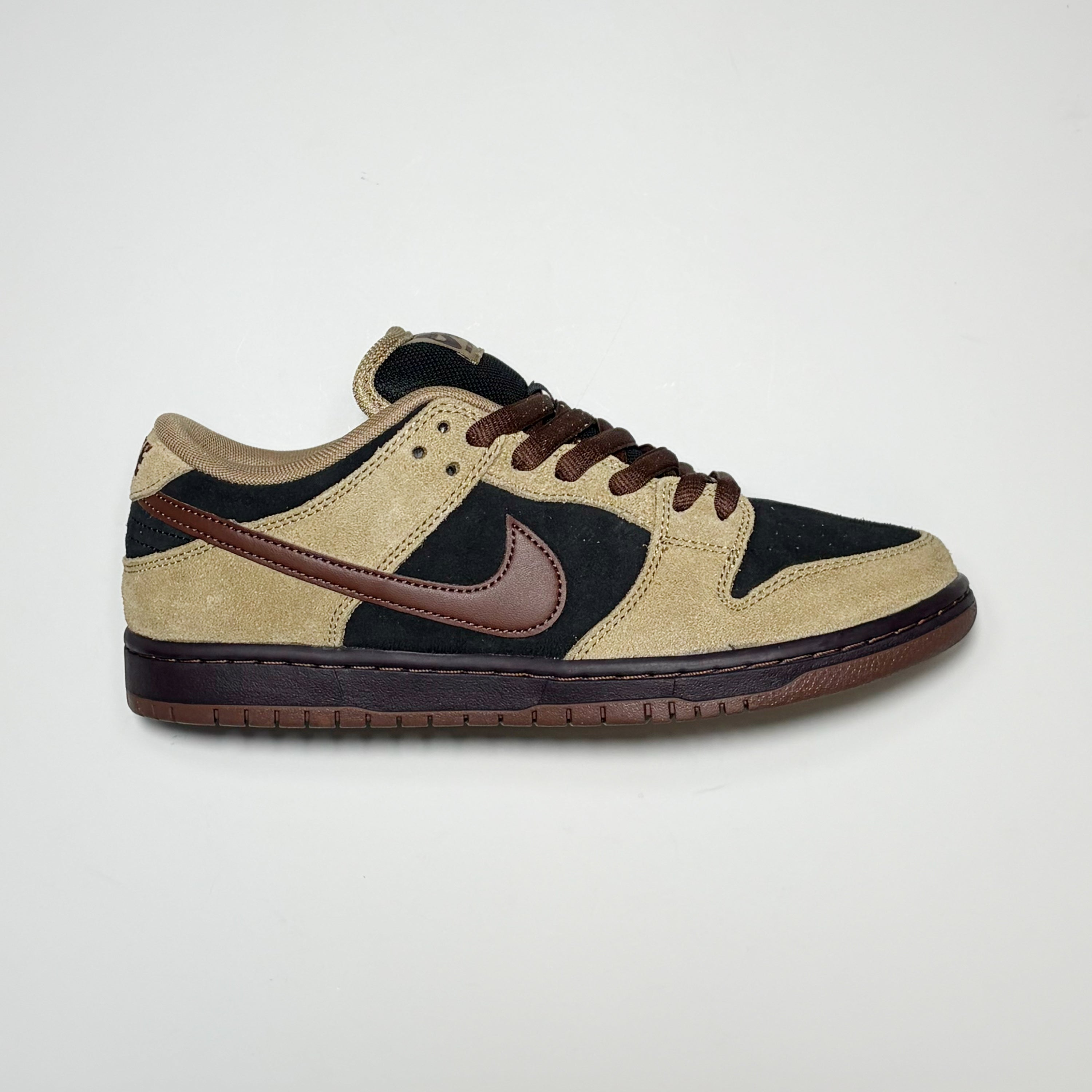 Right side image, Nike SB Dunk Low Pro in Filbert/light chocolate with maroon swoosh. 