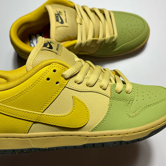 A pair of Nike Dunk Low Pro sneakers in a yellow and light green colorway, featuring a yellow leather Swoosh and collar, a light green toe box and eyestay, and a yellow suede toe cap.
