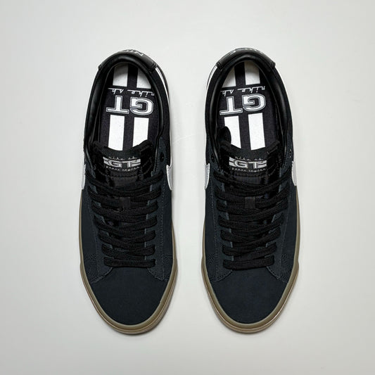 A pair of Nike SB Grant Taylor Blazer Low sneakers. Toe down angle on white background