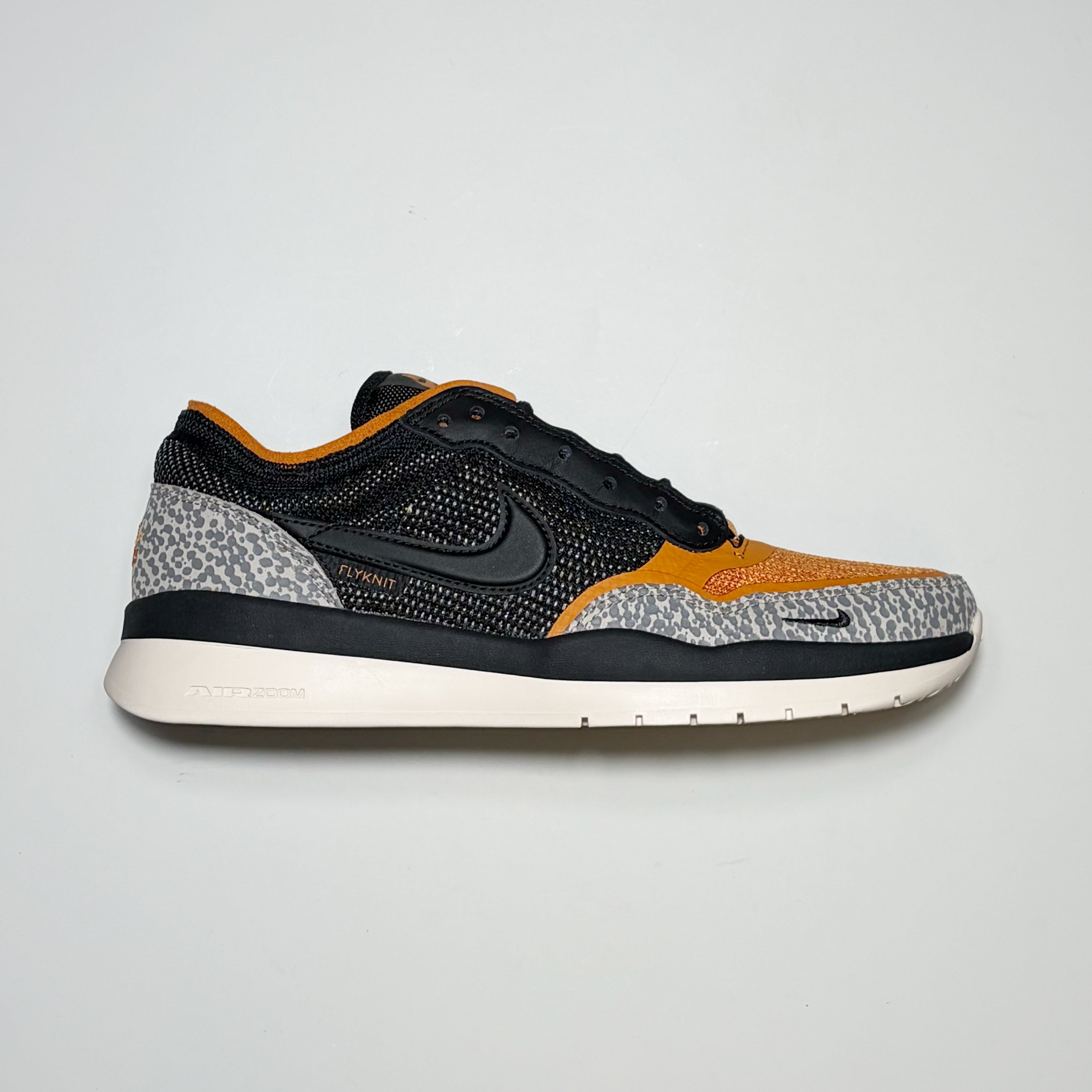 Right side image, Nike SB PS8 skateboard shoes. Running inspired look with cement toe and heel panel with flyknit construction. 