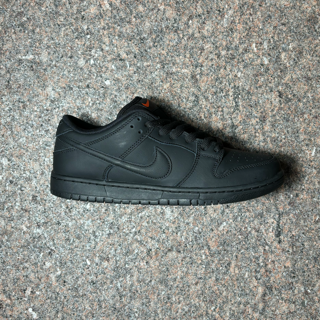 Side profile of right shoe. Black with black panels and outsole with black swoosh.