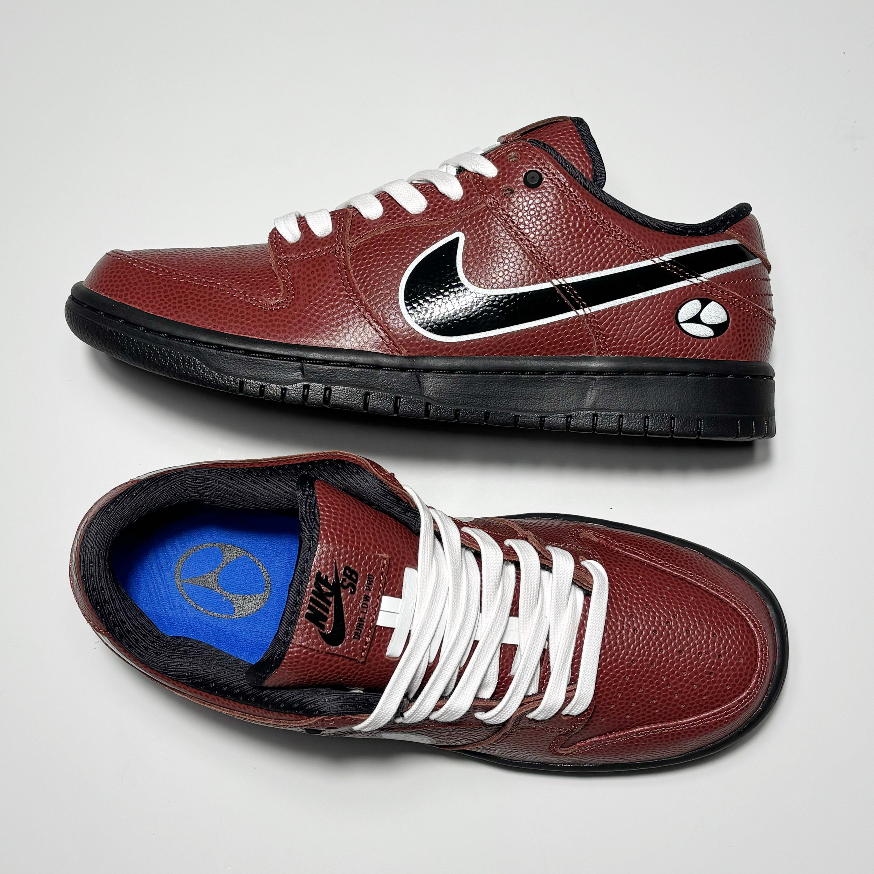 Toe down view with side profile. Nike leather branding on tongue. Custom Limo logo sock liner. 