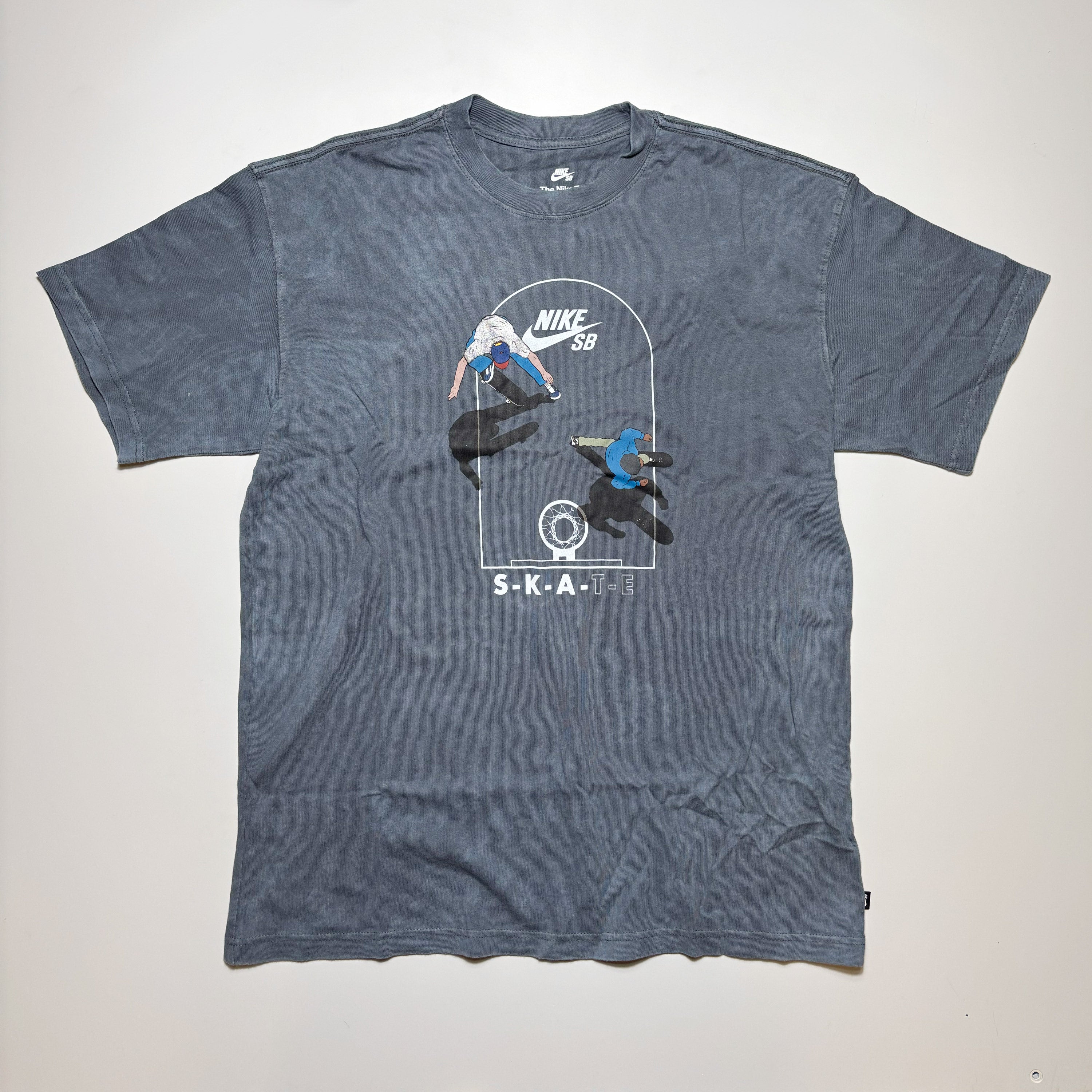 Front image of pigment dyed treated tee with art printed on chest.