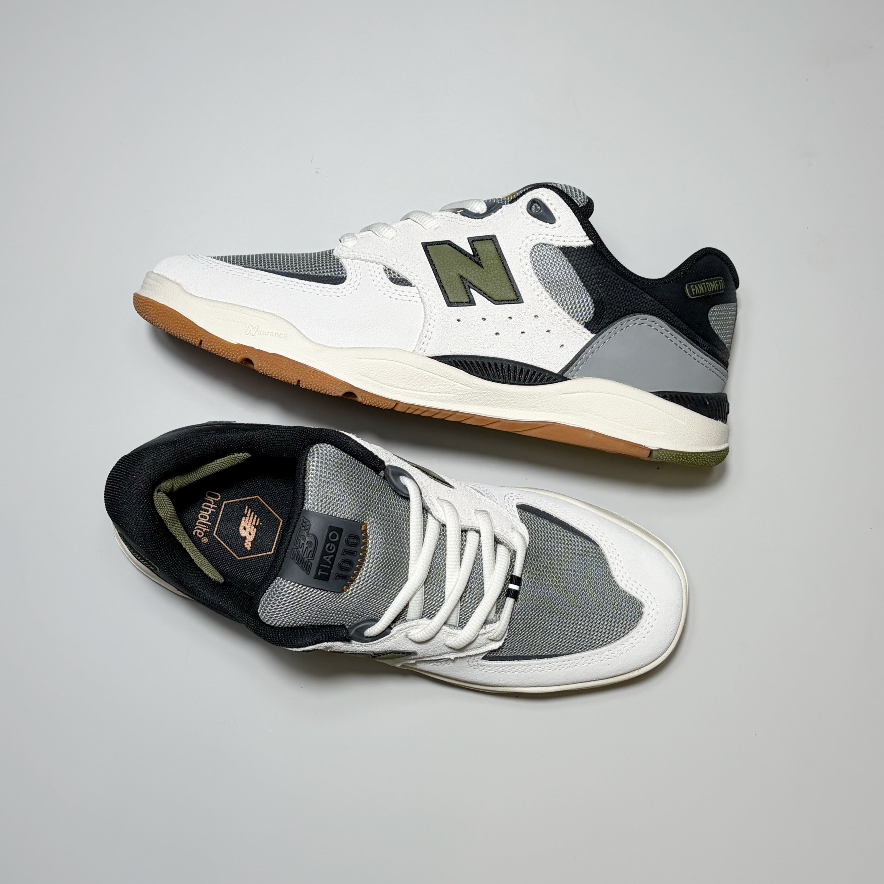 Pair of New Balance Tiago 1010 shoes.