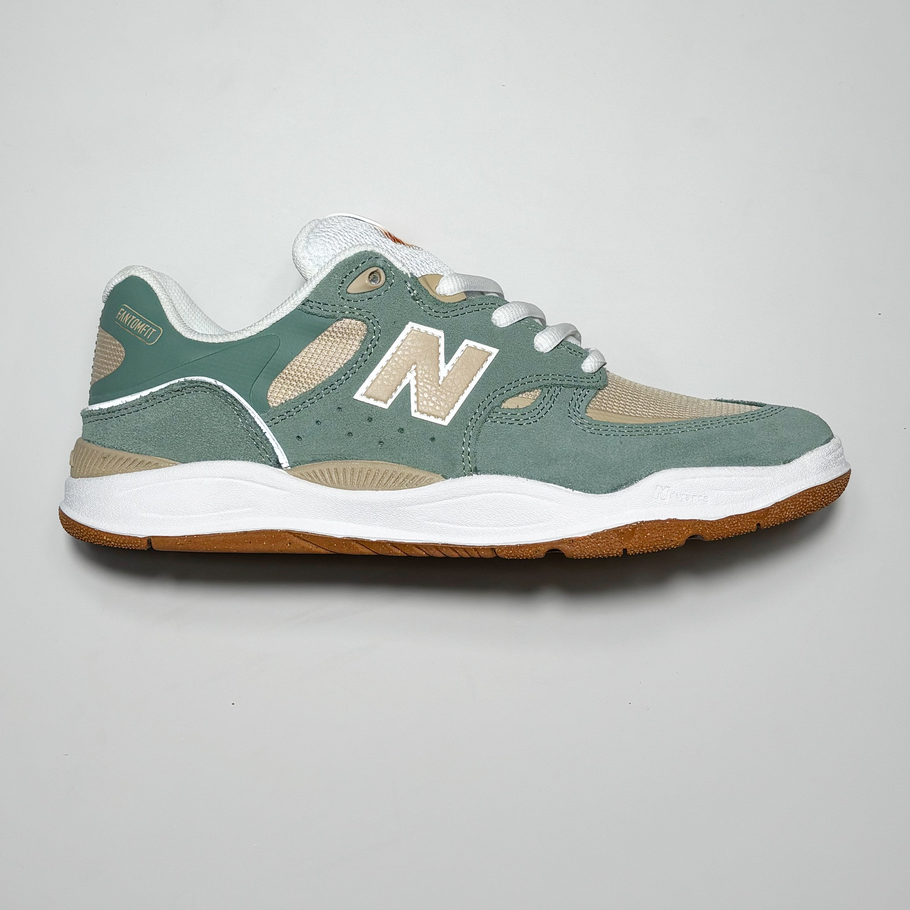 Side image of right shoe.
Sea green with beige N branding.