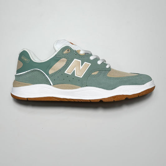 Side image of right shoe.
Sea green with beige N branding.