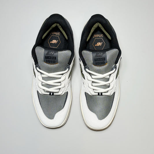 Toe down view of New Balance Numeric Tiago 1010 shoes. White suede toe with grey mesh toe box and tongue.