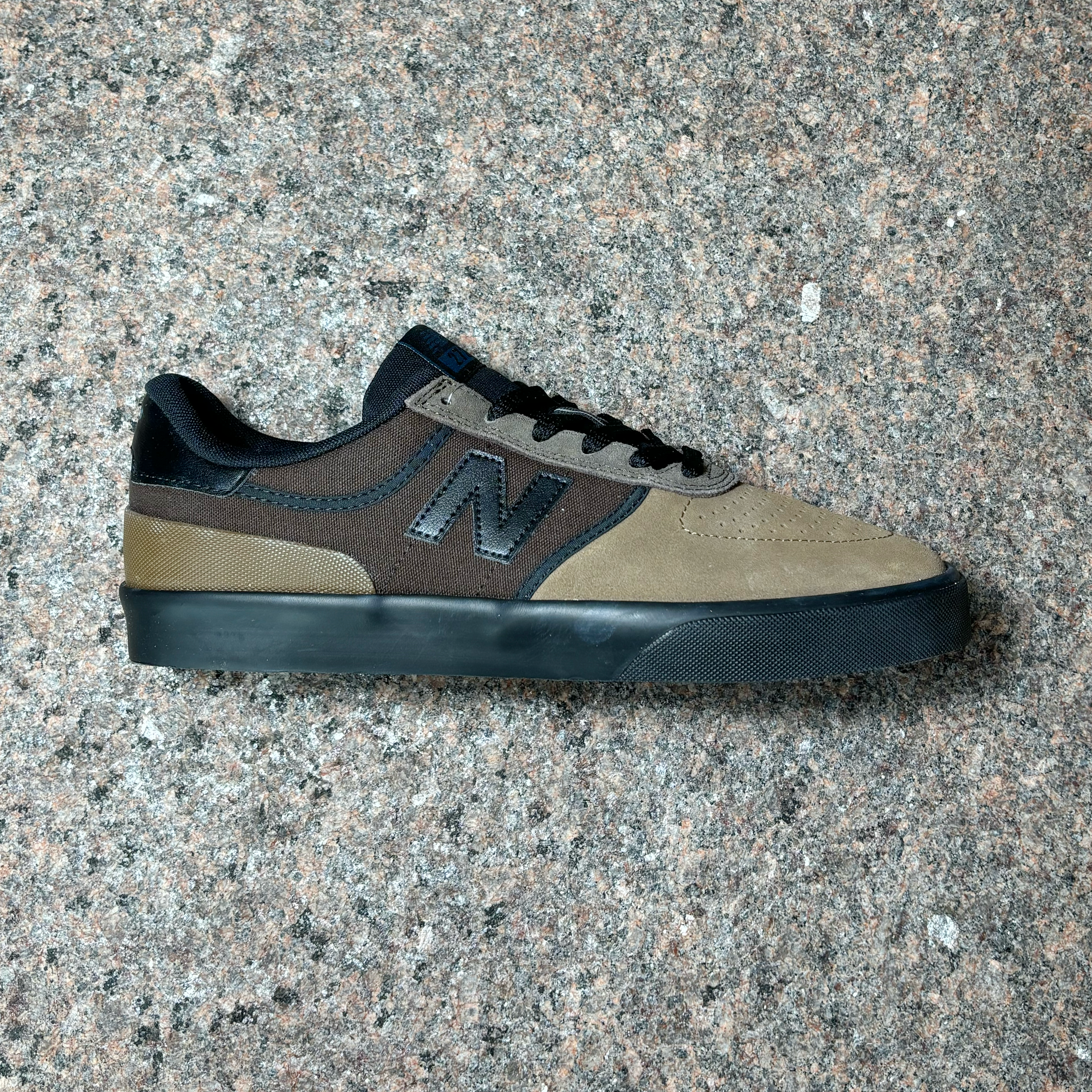 Side profile of right shoe.
Brown mid-panel with army green suede toe and black