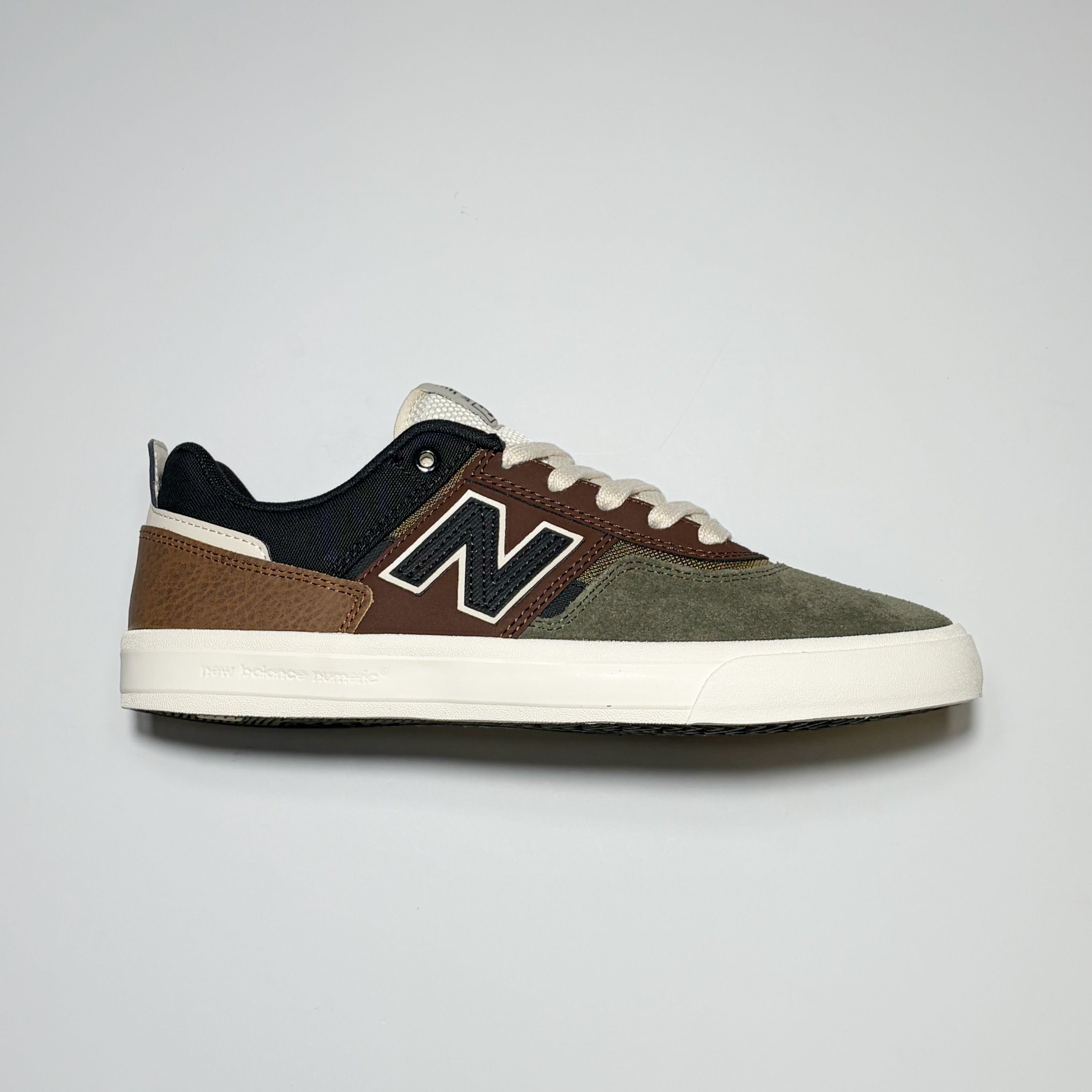 Right side image, New Balance Numeric NM306 Jamie Foy Pro Model footwear in green/brown suede. "N" branding on mid-panel. 