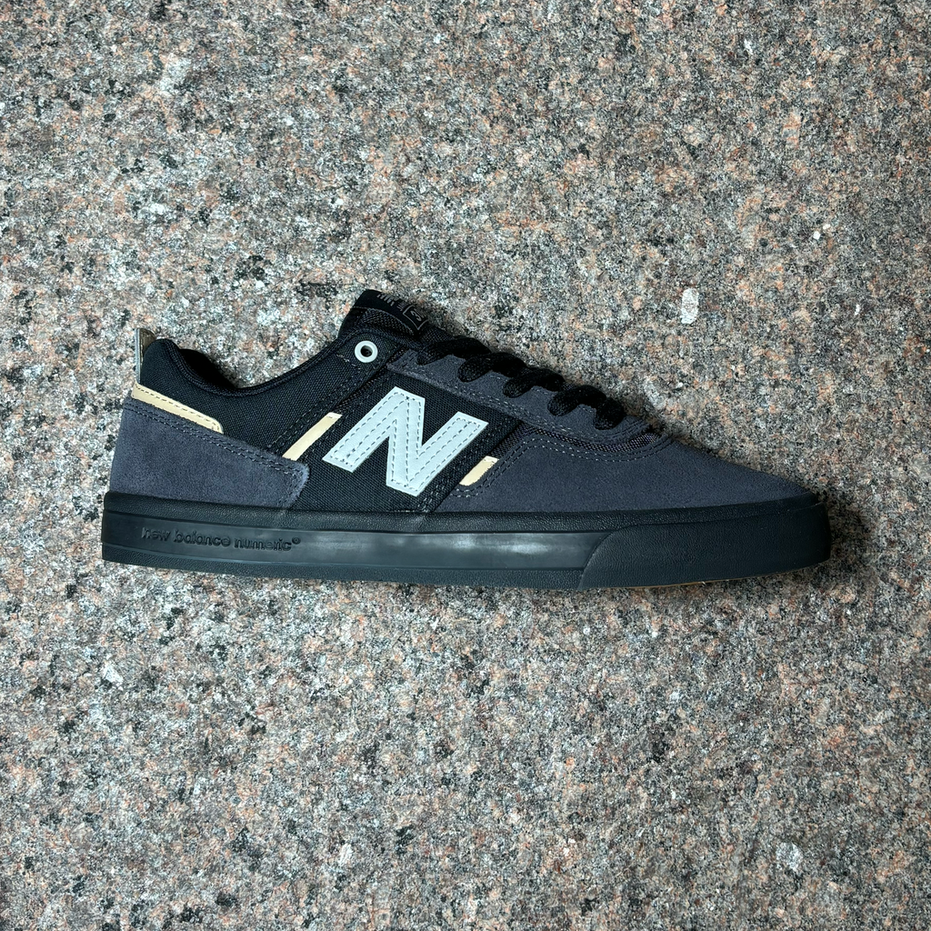 Side profile image of right shoe.
Black suede panels with white 