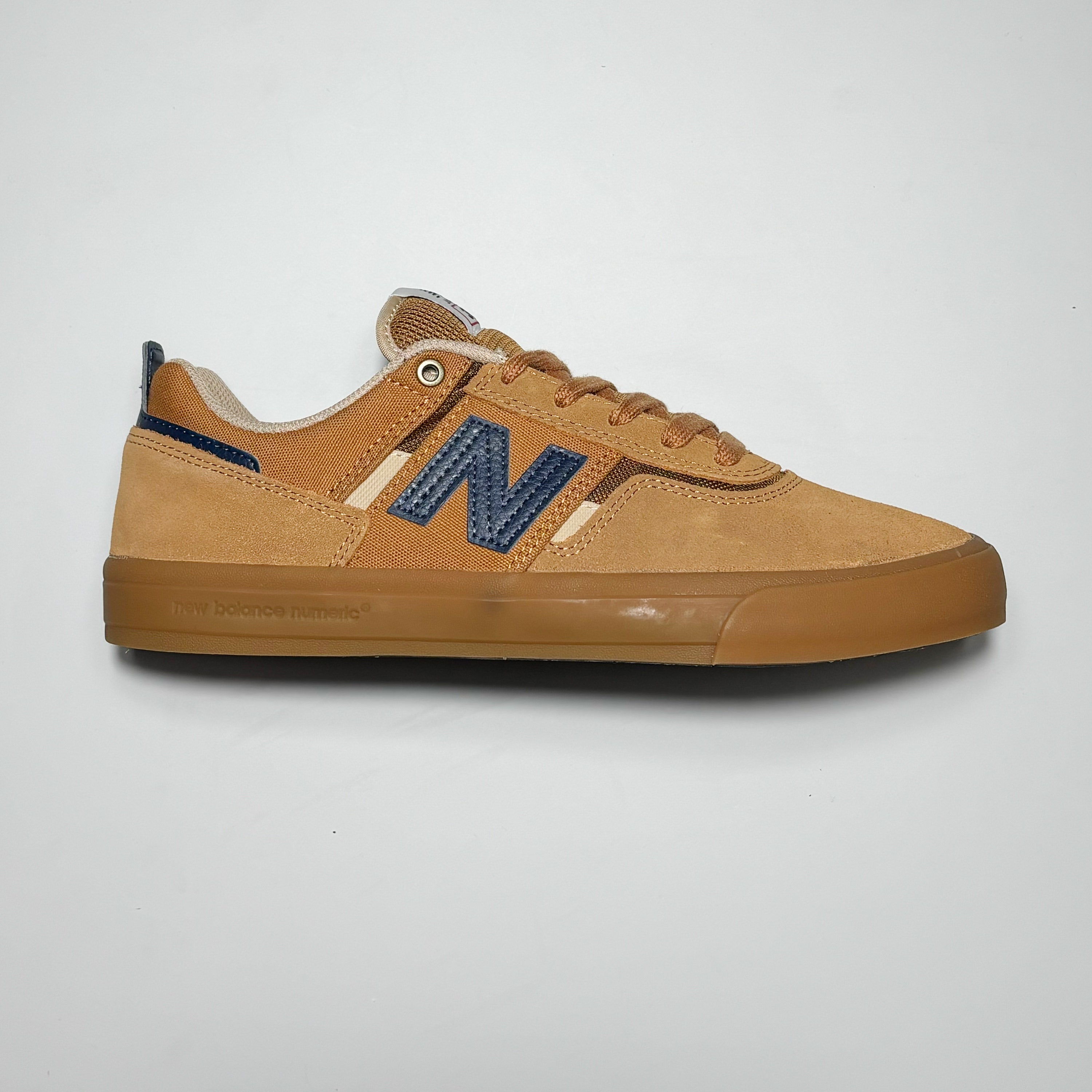 Side image of right shoe.
Brown suede with blue N branding and gum outsole