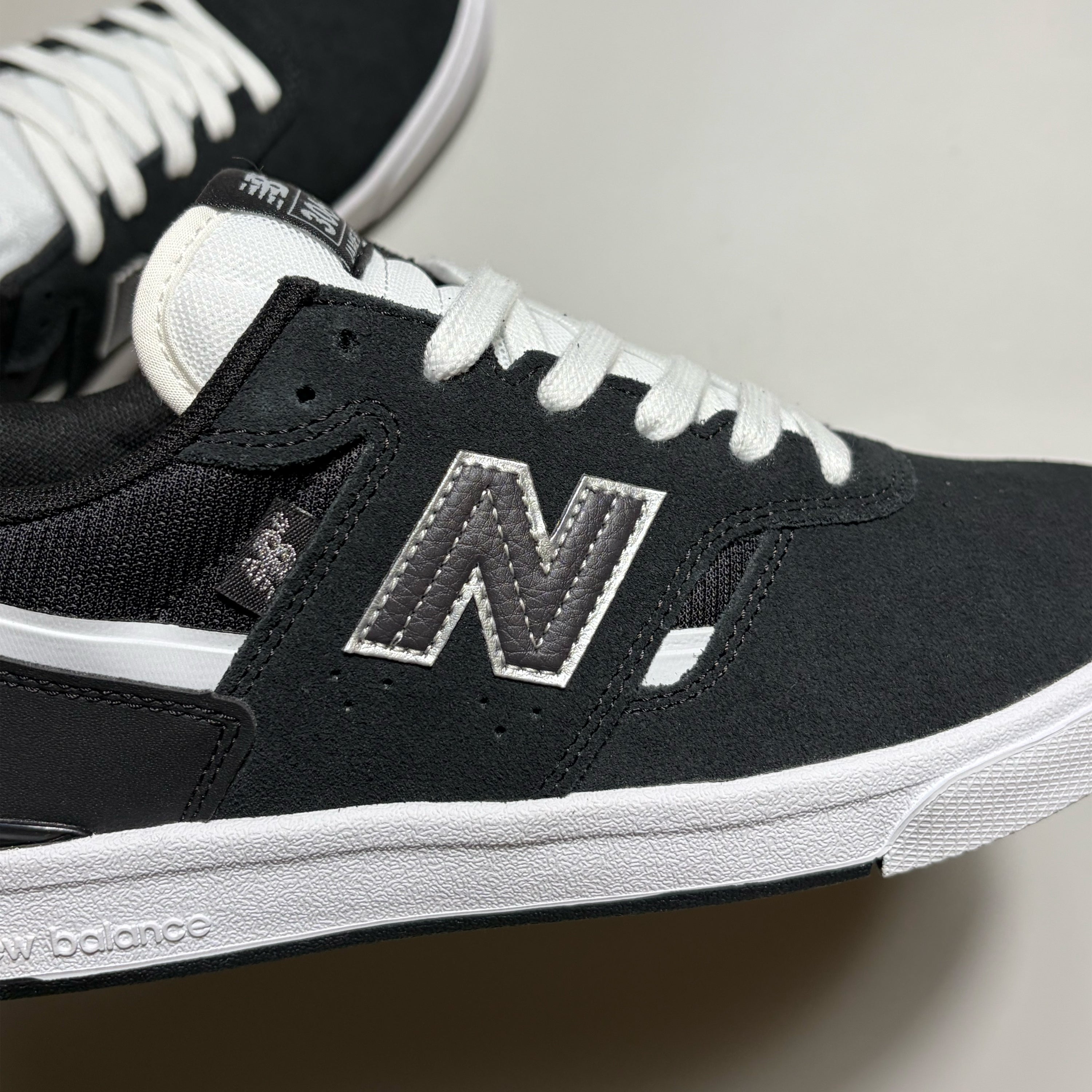 Close detail on "N" branding on mid-panel.