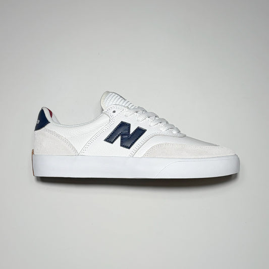 Right side image, white Numeric 340 shoe with navy "N" on mid-panel. 