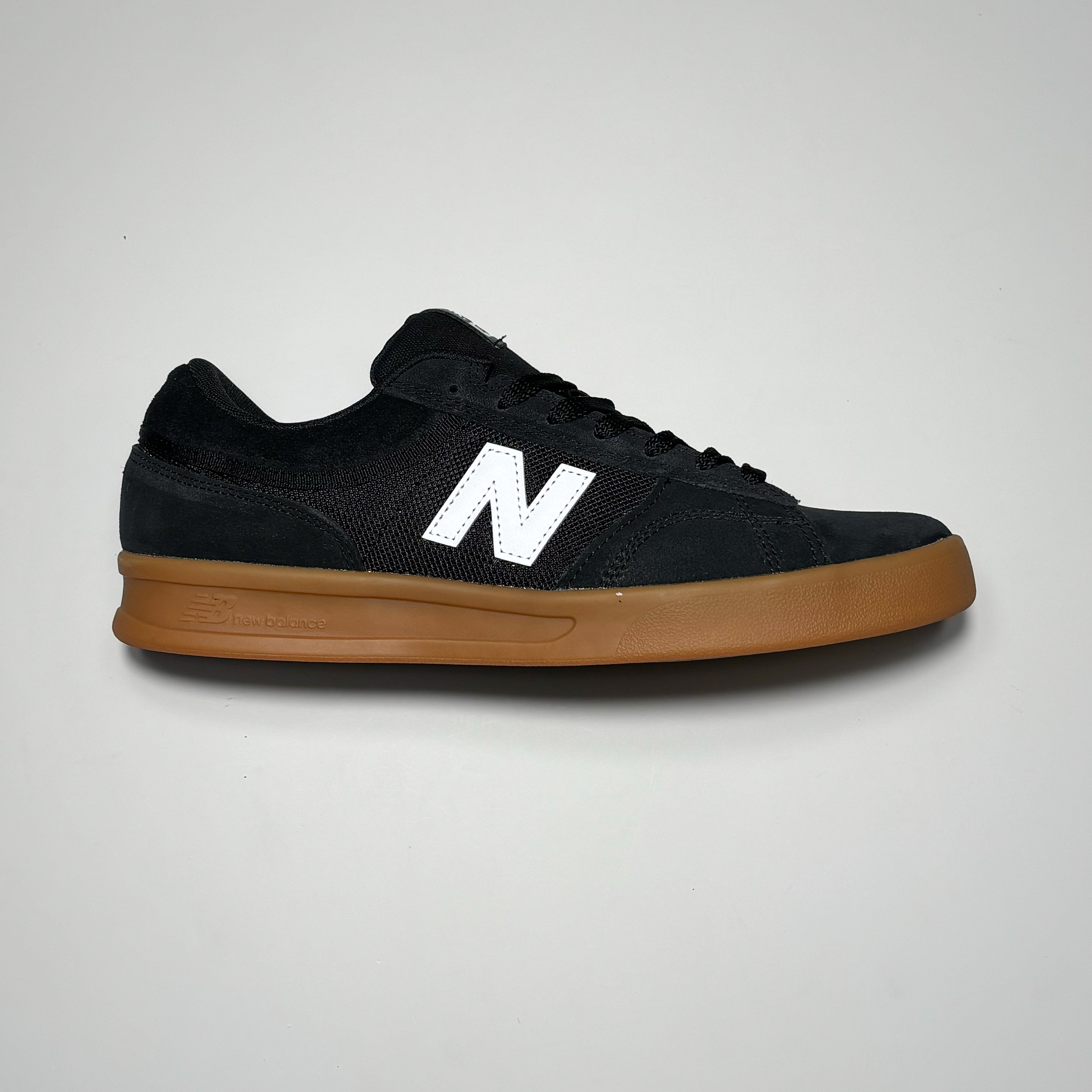 Side image right shoe. Black suede with gum outsole.