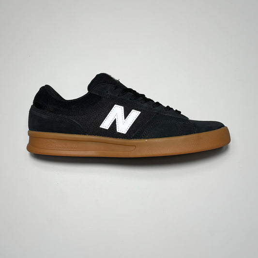 Side image right shoe. Black suede with gum outsole.