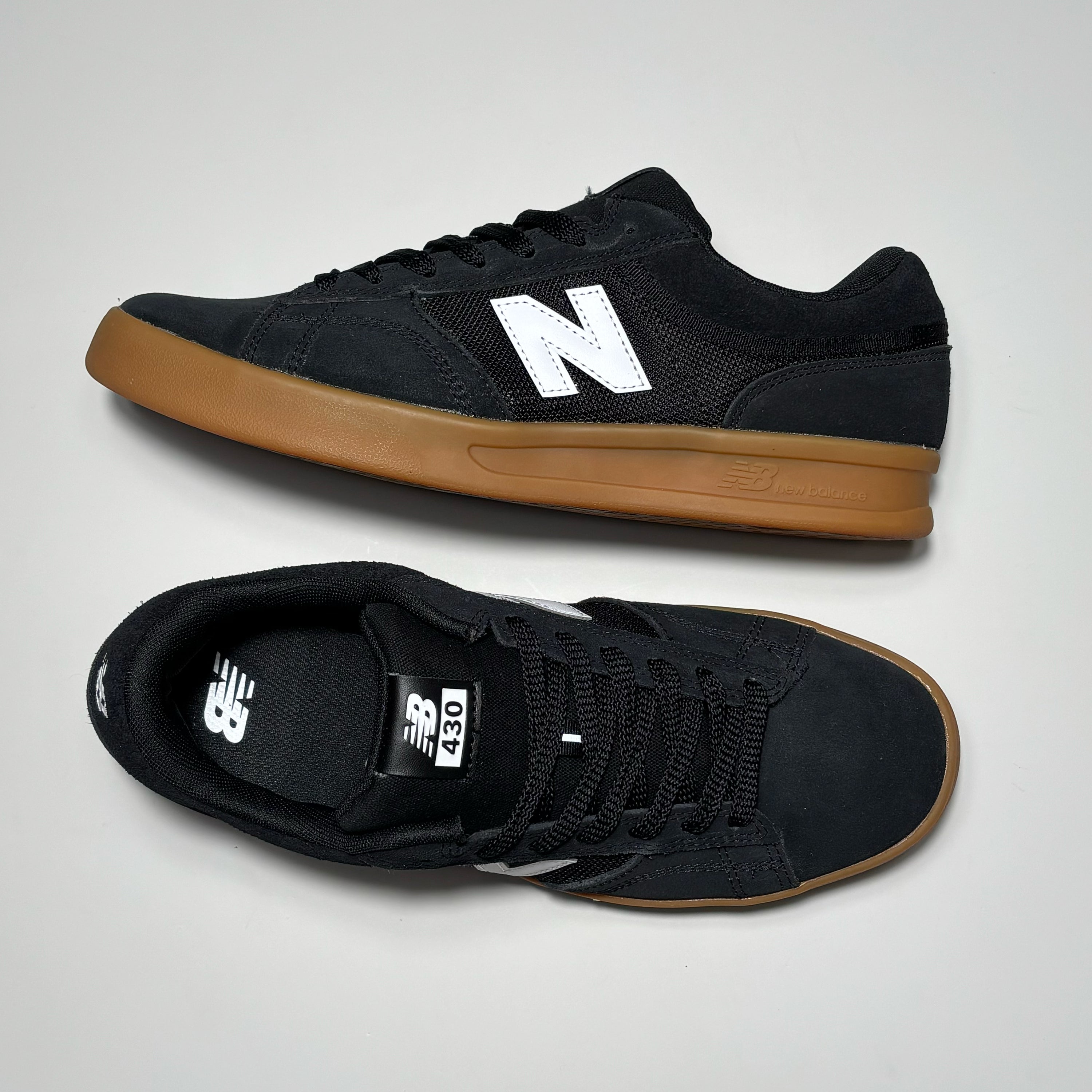 Toe down view side profile. 
NB# woven label on tongue.